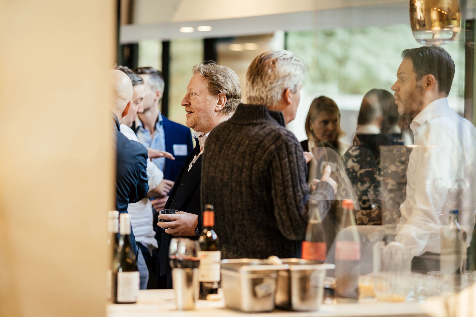 Professionals in conversation during a Lean and operational excellence event