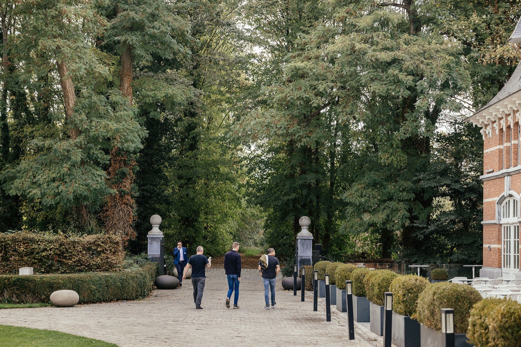 Professionals arriving at a Lean and operational excellence event venue